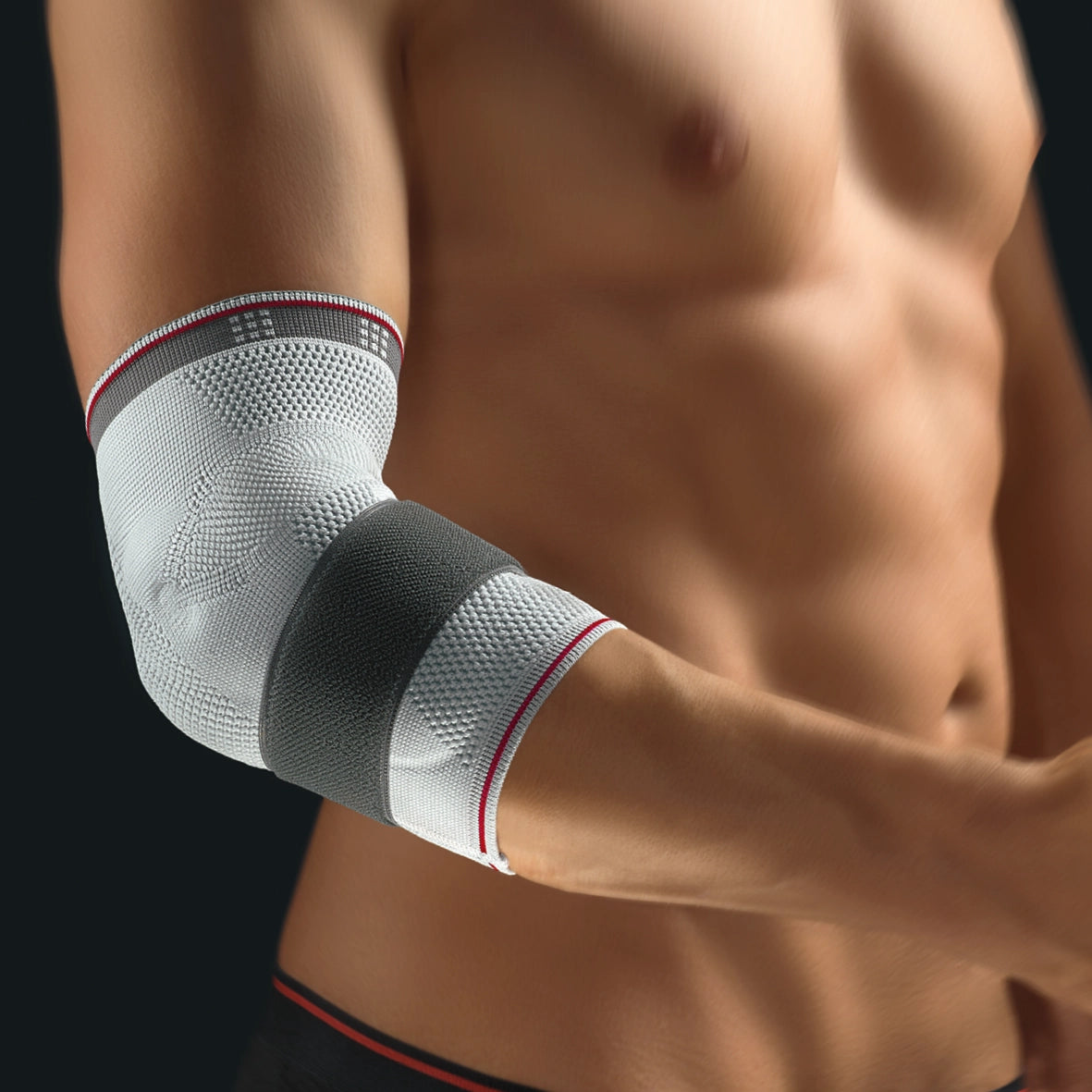 Die Abbildung zeigt die Bort Select EpiPlus Bandage, eine hochwertige Bandage zur gezielten Entlastung und Stabilisierung des Ellenbogengelenks. Sie besteht aus elastischem, atmungsaktivem Material und ist mit zwei speziellen Silikonpelotten ausgestattet, die gezielten Druck auf die Sehnenansätze am Ellenbogen ausüben.